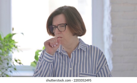 Portrait Of Sick Senior Woman Coughing