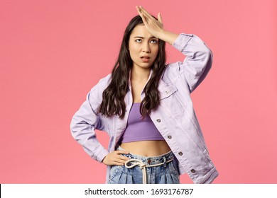 Portrait Of Sick And Tired, Annoyed Young Stylish Girl Taking Care Of New Employee, Facepalm, Do Eye Roll And Punch Forehead Sighing Bothered, Have Lots Of Troubles, Stand Pink Background