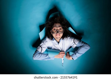 Portrait Of Silly Crazy Woman Chemist With Wacky Look And Goofy Appearance After Scientific Laboratory Explosion. Insane Scientist Expert With Amusing Face Expression And Messy Hair.