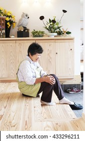 Portrait Of A Sixty Years Old Woman ; Knee Pain, Aging, Tired