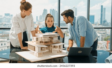 Portrait of skilled architect discussion with engineer team while using laptop. Group of businesspeople brainstorm and analysis building construction. Civil engineering, working together. Tracery - Powered by Shutterstock