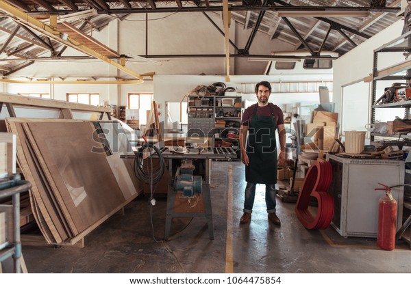 Portrait Skilled Young Craftsman Beard Standing Stock Photo Edit