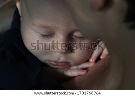 Similar – Newborn lying on the bed with her mother