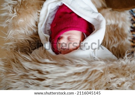 Similar – Baby girl with pompom hat sleeping