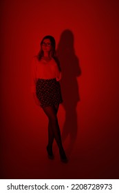 Portrait Of Slender Woman Through Red Filter