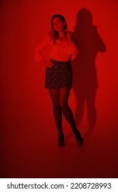 Portrait Of Slender Woman Through Red Filter