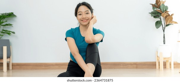 Portrait Slim asian woman smile after yoga at home. Asian woman doing exercises in morning. balance, meditation, relaxation, calm, good health, happy, relax, healthy lifestyle, diet, slim - Shutterstock ID 2364731875