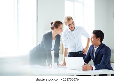 Portrait Of Smart Business Partners Planning Work At Meeting