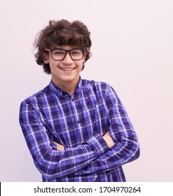 Portrait  Of Smart Looking Arab Teenager With Glasses Wearing A Hat In Casual School Look Isolated On White Copy Space