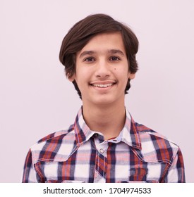 portrait  of smart looking arab teenager wearing a  casual school look isolated on white background copy space