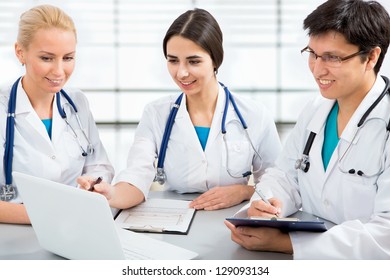 Portrait of a smart young doctors works in a hospital - Shutterstock ID 129093134