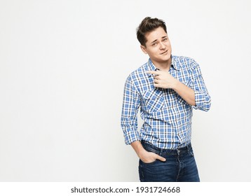 Portrait of a smart young man wearing casual standing against white background