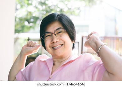 Portrait Of Smile Asian Elderly Mother. Asia Face Adult Older People With Happy Expression Wear Pink Shirt.
