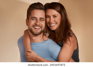 Portrait, smile and couple hug in home for bonding, piggyback and laughing together for care. Face, happy man and woman embrace for healthy relationship, support and connection in apartment for love - Powered by Shutterstock