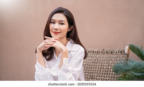 Portrait smile happy beautiful innocence asian woman relax. Asian girl face on white shirt Beauty long hair spa woman treatment perfect clear cosmetology skin. Japanese girl makeup lifestyle lifestyle