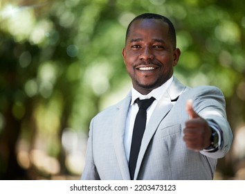 Portrait, Smile And Happy Businessman With Thumbs Up For Achievement, Goal And Success In His Corporate Job While Outdoor In A Park. Employee With Hand Sign Or Icon For Thank You, Winner And Vote