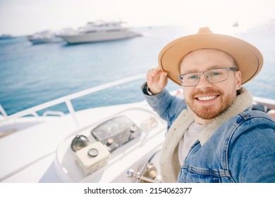 Portrait Smile Happy Man Driver Captain Of White Luxury Yacht Holding Helm Wheel, Summer Travel On Boat Sea.