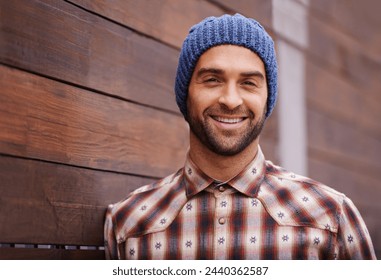 Portrait, smile and man on wood wall background outdoor in casual clothes, outfit or apparel. Face, happy and stylish person in beanie, shirt and trendy fashion for profile picture with hat in Spain - Powered by Shutterstock