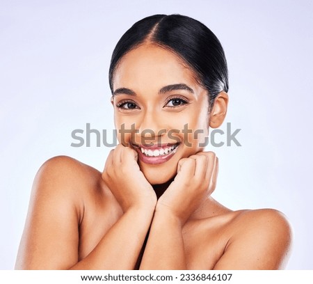 Portrait, smile and skincare with a model woman in studio on a gray background for natural wellness. Face, beauty and aesthetic with a happy young person posing for luxury cosmetics or dermatology