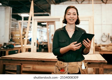 Portrait, smile and tablet with carpenter woman in workshop for craftsmanship, joinery or woodworking. Industry, online order and technology with confident person in warehouse for carpentry or trade - Powered by Shutterstock