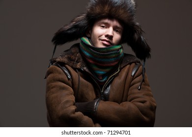 Portrait Of Smiley Man In Fur Hat And Coat