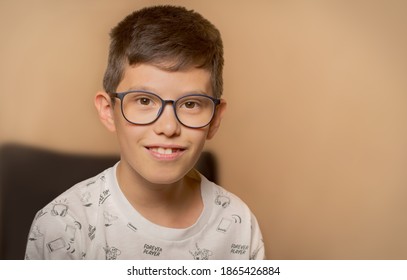 Portrait Of Smiling 10 Year Old Boy With Glasses.