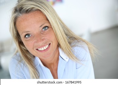 Portrait Of Smiling 40 Year Old Woman