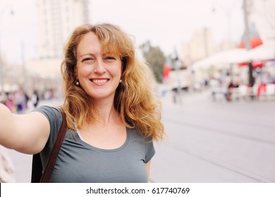 Portrait Of Smiling 40 Years Old Woman Outdoors