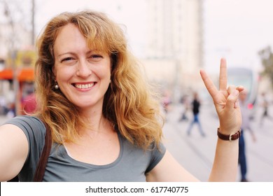 Portrait Of Smiling 40 Years Old Woman Outdoors