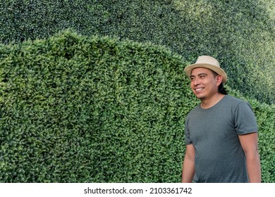 Portrait Of A Smiling Aboriginal Man Outdoors With A Nature Background.