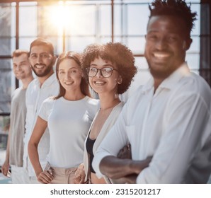 Portrait of smiling African American business man with executives working in background - Shutterstock ID 2315201217