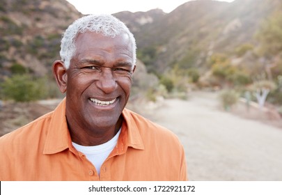 Portrait Of Smiling African American Senior Man Outdoors In Countryside