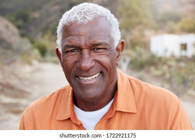 Portrait Of Smiling African American Senior Man Outdoors In Countryside - Powered by Shutterstock