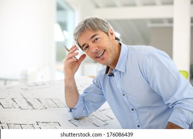 Portrait Of Smiling Architect Working In Office