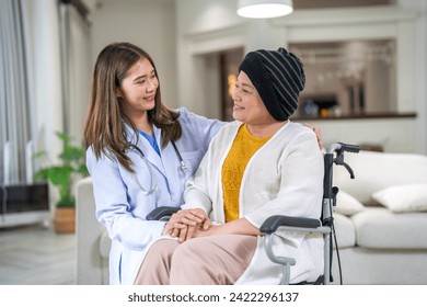 Portrait of smiling asian doctor service help support discussing and consulting taking care, caring, caregiver with senior elderly woman with cancer cover head of chemotherapy cancer, cancer day - Powered by Shutterstock