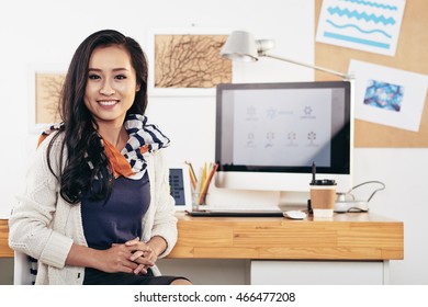 Portrait Of Smiling Asian Graphic Designer At Her Workplace