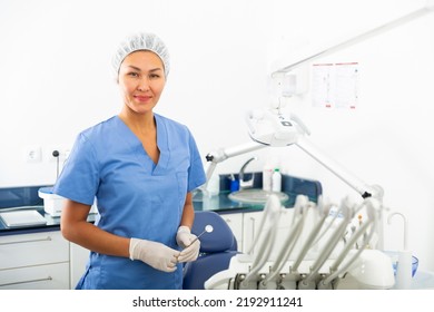 Portrait Of A Smiling Asian Woman Dentist Standing In The Office At The Workplace In The Clinic