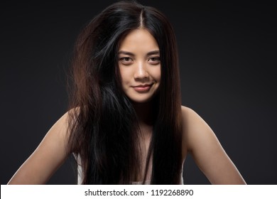 Portrait Of Smiling Asian Woman With Half Knotted And Straight Hair Isolated On Black, Keratin Hair Treatment Concept