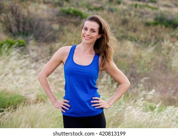 Portrait of smiling attractive  woman with blue tank top - Powered by Shutterstock