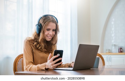 Portrait Of Smiling Beautiful Caucasian Woman With Stay Home Working In Office Desk Using Phone Head Set Computer. Small Business Employee Freelance Online Sme Telemarketing Home School Concept