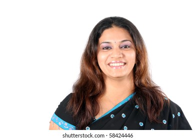A portrait of a smiling beautiful Indian woman in a sari, on white studio background. - Shutterstock ID 58424446