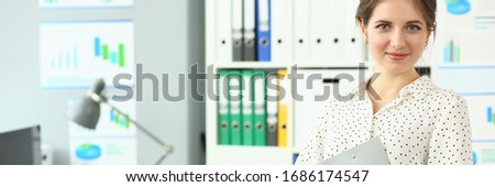 Portrait of smiling beautiful lady in modern meeting room. Businesswoman visiting business negotiation in international firm. Biz company concept. Blurred background