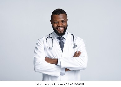 Portrait Of Smiling Black Male Doctor With Stethoscope On White Background