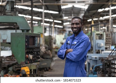 Portrait Of Smiling Black Male Engineer At Work In The Industry Factory. 