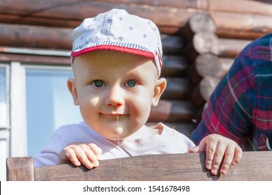 Portrait Of A Smiling Blue Eyed Baby Drooling