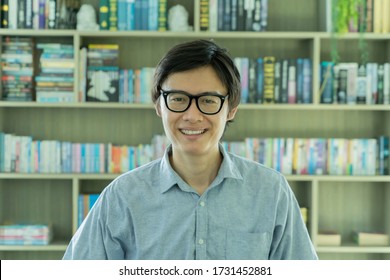 Portrait Of Smiling Business Asian, Chinese Man Person Working From Home And Talking To His Colleagues In Webcam Group Video Call Conference On Internet Online In Quarantine In Corona Virus Pandemic