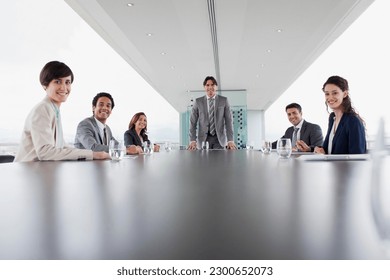 Portrait of smiling business people in conference room - Powered by Shutterstock