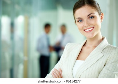 Portrait Of A Smiling Business Woman Looking Confidently At Camera