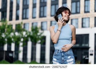 Portrait of a smiling Business woman Using iPhone 13 pro