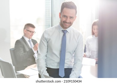 Portrait Smiling Businessman In Conference Room Meeting